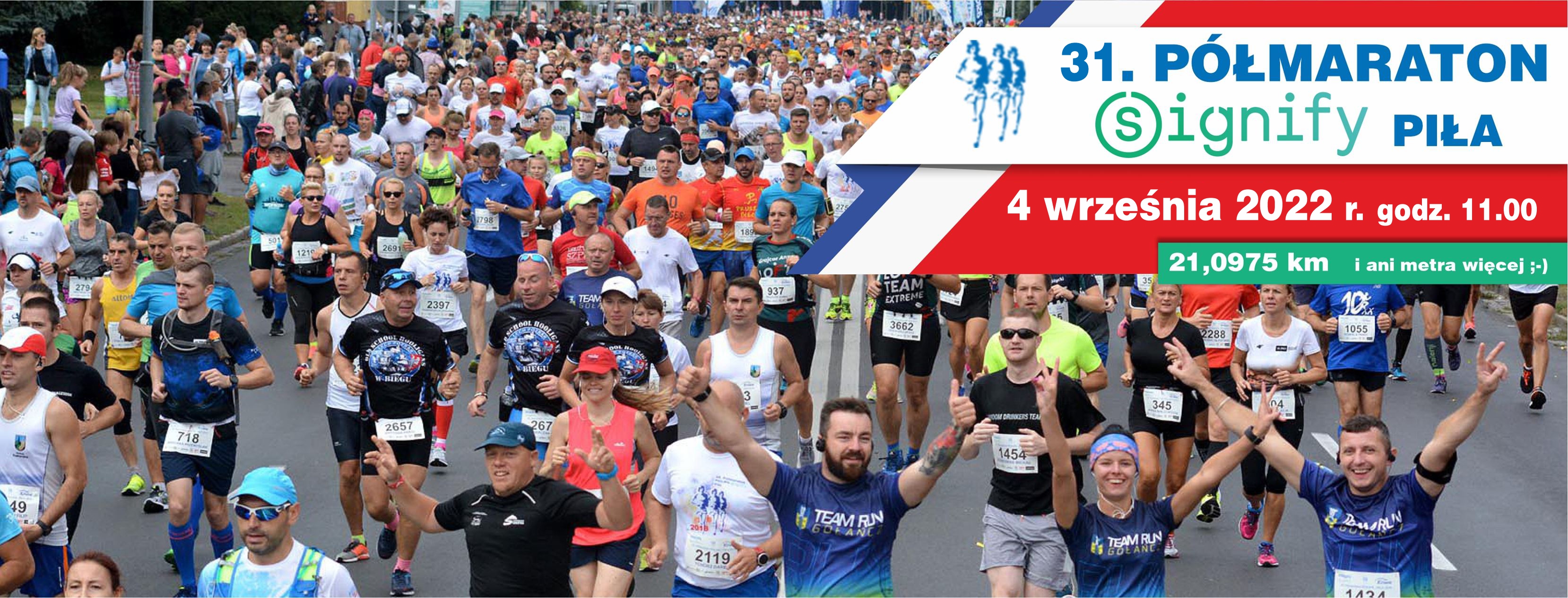 Na zdjęciu duża grupa biegaczy, obok treść: 31 półmaraton signify piła, 4 września 2022, godz. 11.00. 21,0975 km i ani metra więcej.