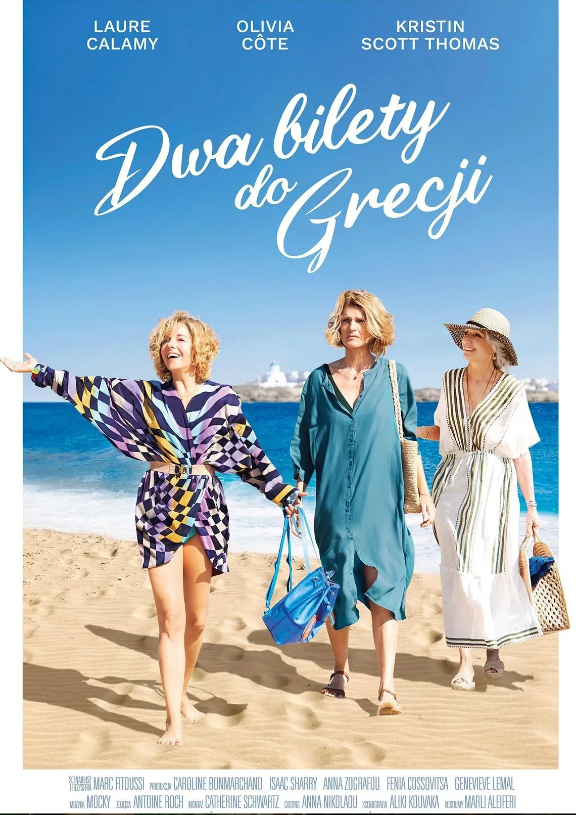3 uśmeichnięte kobiety idą po piasku, w tle morze, napis: Dwa bikety do Grecji